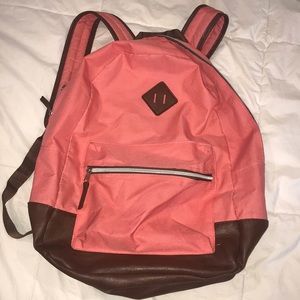 pink and brown leather backpack